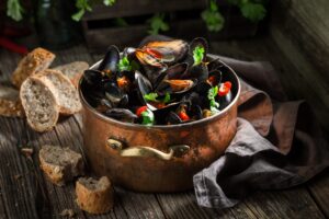 Closeup of mussels with garlic and coriander